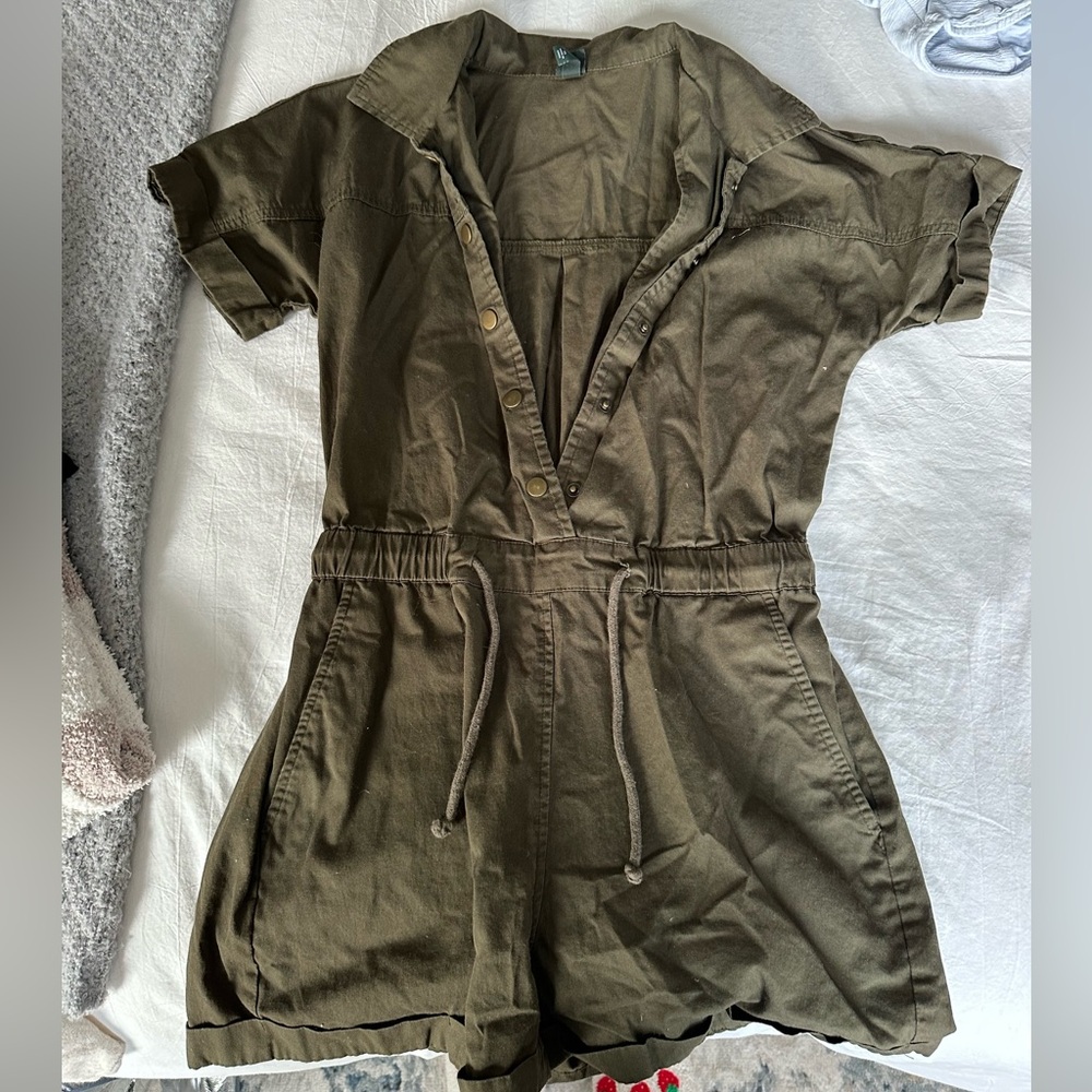 Olive-colored short sleeve and shorts jumpsuit